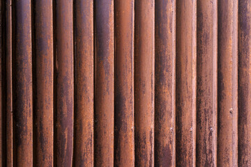 Texture of rusty corrugated metal with distinctive weathered patterns, ideal for grunge-style...