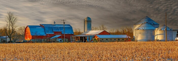 New Jersey Farm, early moring with snow and corn field, red barn and grain silos © Bob