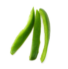 Sliced green bell pepper in a bowl on white background