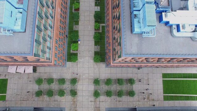 People walk near office buildings of Alcon complex 