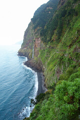 Coastal waterfall of C&oacute;rrego da Furna on the north coast of Madeira island (Portugal) in the Atlantic Ocean, seen from the V&eacute;u da Noiva viewpoint on the abandoned portion of the ER101 coastal route
