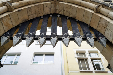 wooden portcullis with spiked metal caps at a medieval gate castle in bonn