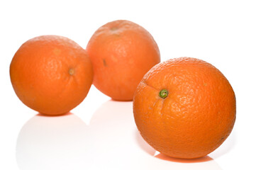 three juicy oranges on a white background studio shooting 2