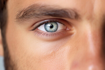 Close-up of young man's eye, isolated on white background