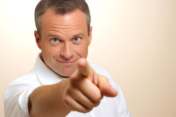 Portrait of a handsome mature man pointing at you with his finger
