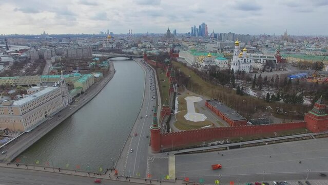 Townscape with traffic on quay of Moskva river near Kremlin complex