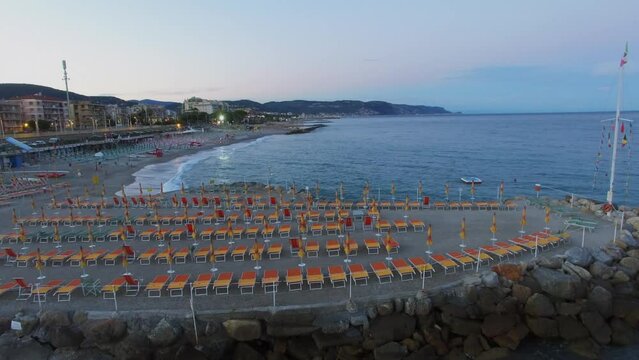 Loano, Italy, Marina beach with sunbeds and parasols at summer 