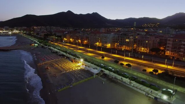 Loano, Italy, Cityscape with train rides near sea beach at summer 