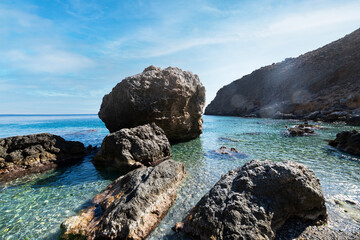 Seascape Crete Greece  rugged rocks formations in clear blue green ocean water - 720904017