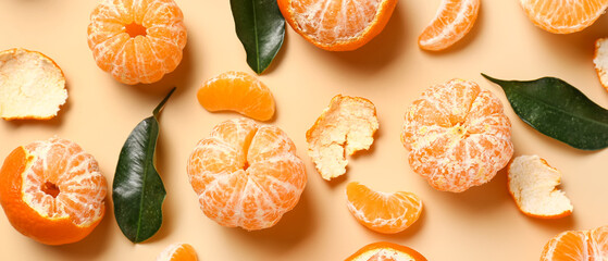 Sweet peeled tangerines on beige background, top view