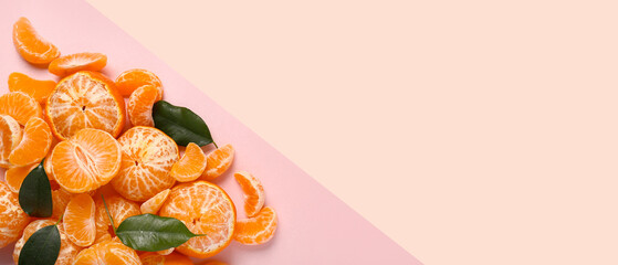 Sweet peeled tangerines on pink background with space for text, top view