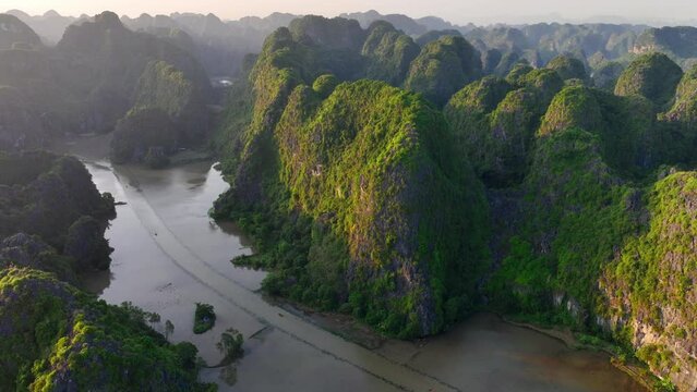 Ninh binh valley in Vietnam, aerial view of beautiful Tam Coc carst mountains in Vietnam at sunrise, tourism in Southeast Asia, Vietnam travel