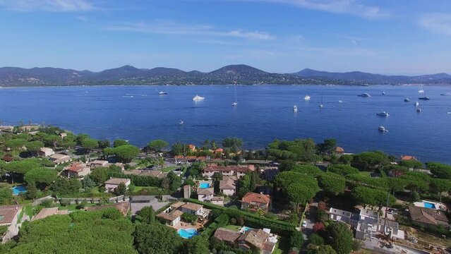 Gassin, France, Town panorama with road traffic on shore of sea bay