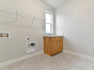 Modern residential empty laundry room interior