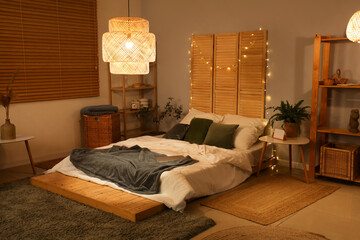 Interior of bedroom with glowing lights and plants at night