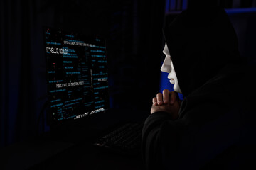 White criminal anonymous mask as hack programmer trying to approach main database server drive...