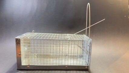 close-up of a non-lethal mousetrap. black background with copy space