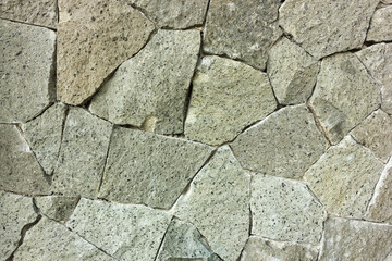 Stone wall background of the building 