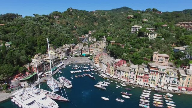 Cityscape with many vessels are in dock of Portofino at summer