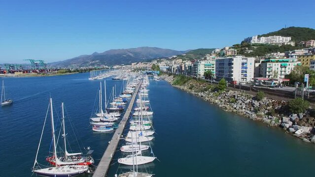 Many boats on moorage in tourist landing marina Castelluccio 