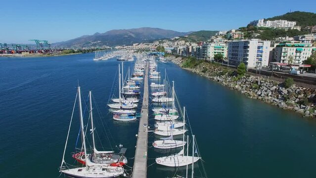 Lot of yachts on moorage in tourist landing marina Castelluccio 
