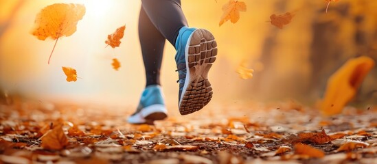 Female runner's feet in motion during autumn run, blurring in fitness exercise.