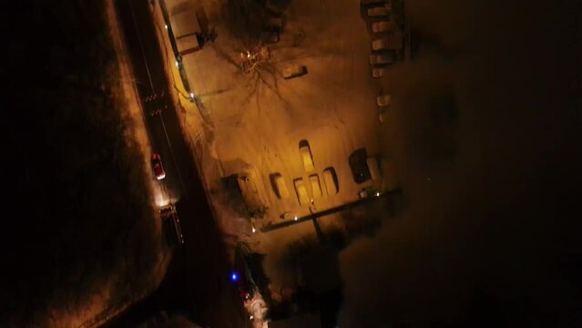 Accident place and fire-engines near parking at winter evening