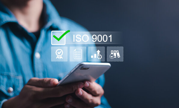 ISO 9001 Standard certification standardisation quality control concept, Person use smartphone with virtual ISO 9001 icons for certified and quality management of organizations.