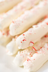 Candy cane chocolate covered pretzel rods