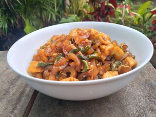 Kikil or cow skin with spicy flavors is minang cuisine of West Sumatra, Indonesia. Kikil Cooked using Indonesian herbs, such as red chilies, shallots, garlic, tomatoes, etc.