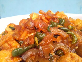 Kikil or cow skin with spicy flavors is minang cuisine of West Sumatra, Indonesia. Kikil Cooked using Indonesian herbs, such as red chilies, shallots, garlic, tomatoes, etc.