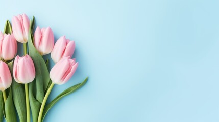 Bouquet of pink tulips on blue background. Flat lay, top view Generative AI