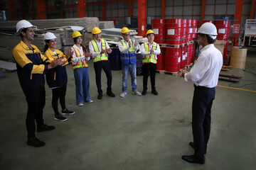 Fototapeta premium worker or engineer working in factory with safety uniform , safety hat and safety glasses , image is safety concept or happy workplace