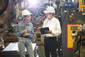 worker or engineer working in factory with safety uniform , safety hat and safety glasses , image...
