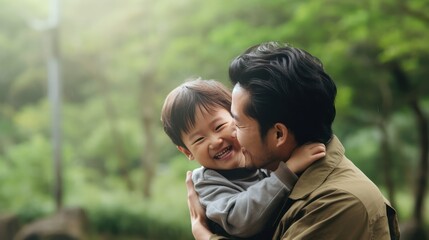 Father, bonding kiss and boy child hug happy in nature with quality time together outdoor. Happiness, laughing and family love of a dad and kid in a park enjoying nature hugging with care and a smile.