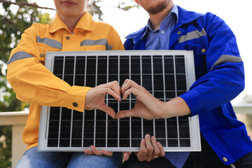 The engineering designer had a discussion with his teamwork at  solar panels about the prototype of the solar cell at the field