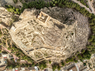 Aerial view of Medieval Castle of San Juan and the town of Calasparra in Murcia Spain with old quarter wrapped around the foot of the hill