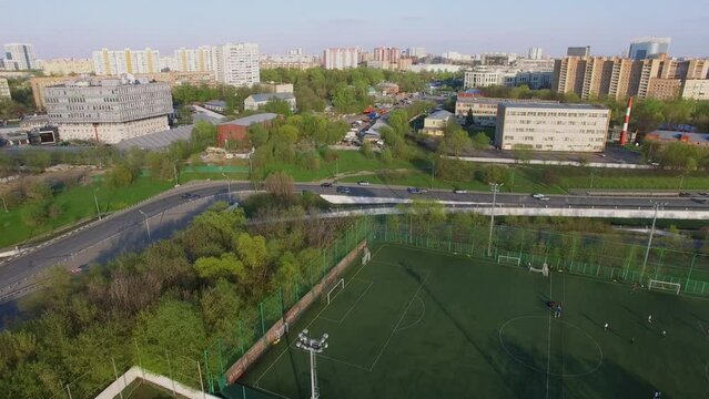 Cityscape with traffic near several soccer fields of Spartak Club