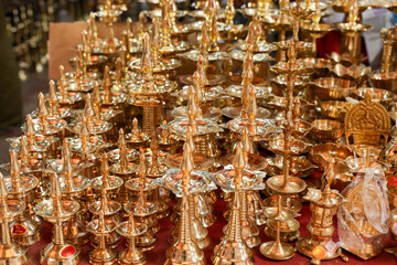 Indian traditional samai or samayee diya brass lamp. Hindu puja stuff or puja thali many lamp near...