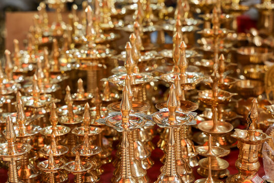 Indian traditional samai or samayee diya brass lamp. Hindu puja stuff or puja thali many lamp near temple for yoga worship 