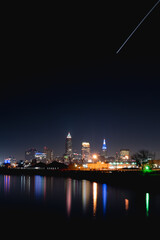 City of Cleveland at Night with Airplane Light Trail Portrait Shot