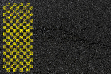 Damier jaune sur asphalte 