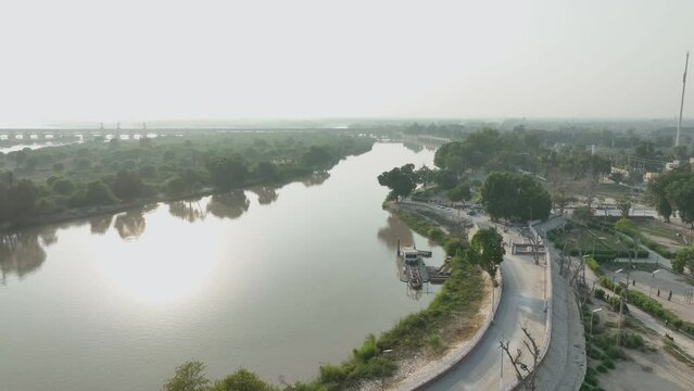 Curved road along Indus River, Sukkur, Sindh - aerial