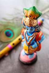 Sri Krishna statue with peacock feather. Lord Krishna Standing with Flute. Vishu festival Kerala...