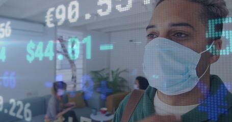 Image of digital interface showing statistics with colleagues in office wearing face masks