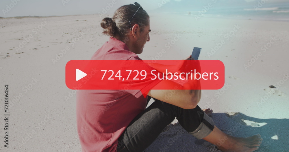 Poster image of speech bubble with subscribers text and numbers over man using smartphone on beach