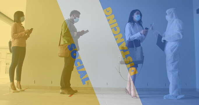 Image of words social distancing with diverse colleagues having their temperature checked - Powered by Adobe