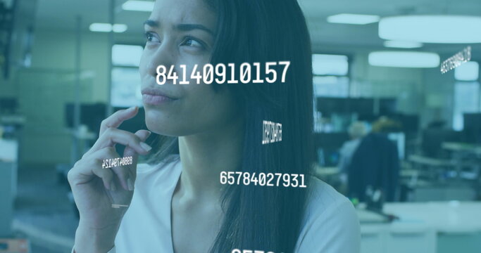 Image of floating numbers with woman working in an office