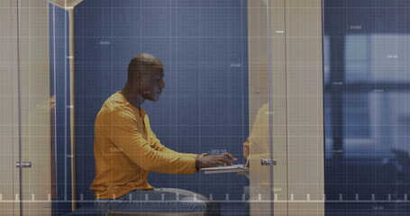 Image of financial data processing over african american businessman in office