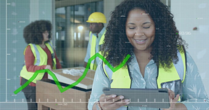 Image of data processing over biracial female engineer in hi vis vest using tablet